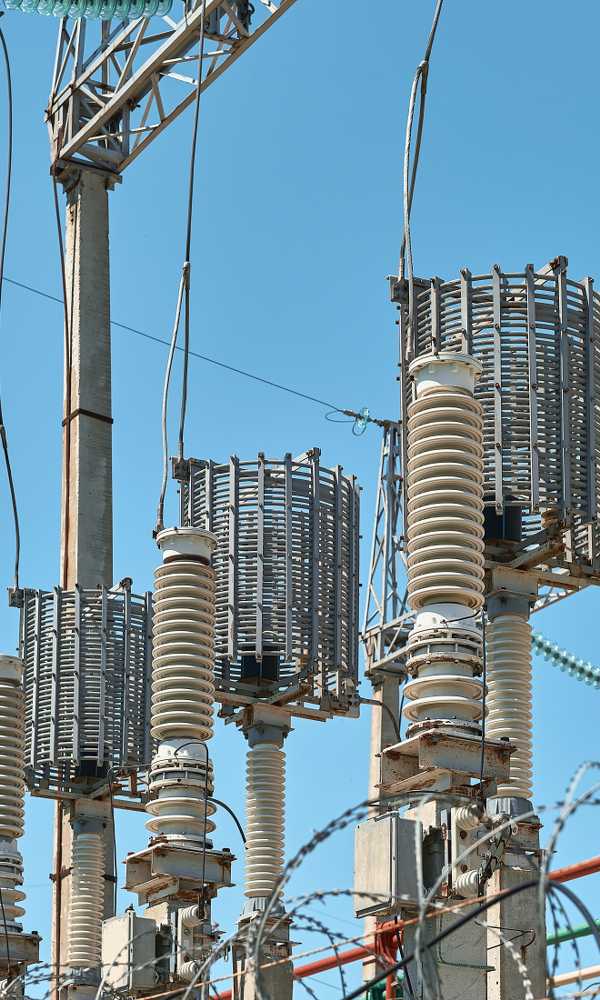 High voltage electrical transformers in an electricity distribution power plant. Close-up